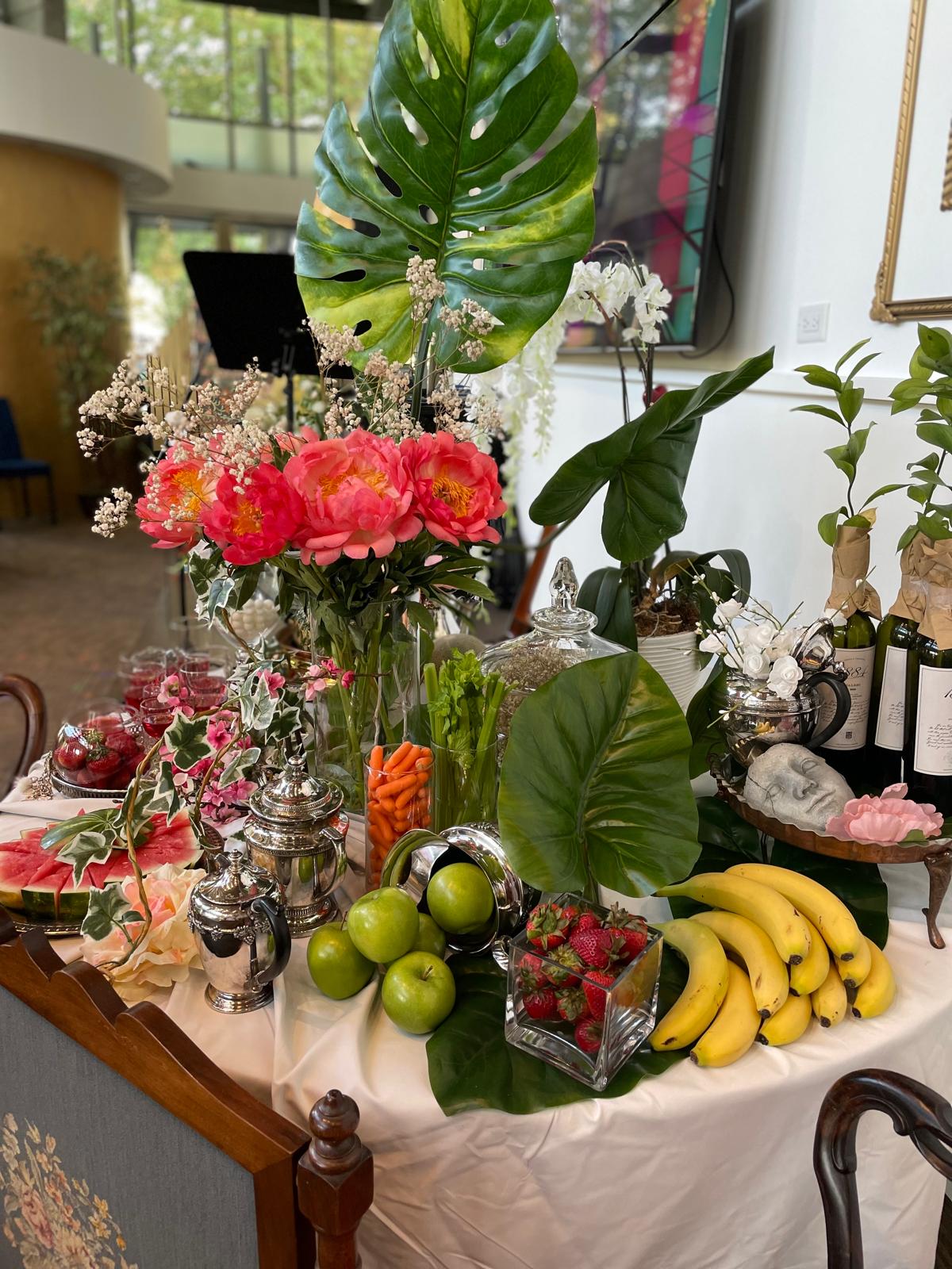Celebration table — peonies & tropical leaves