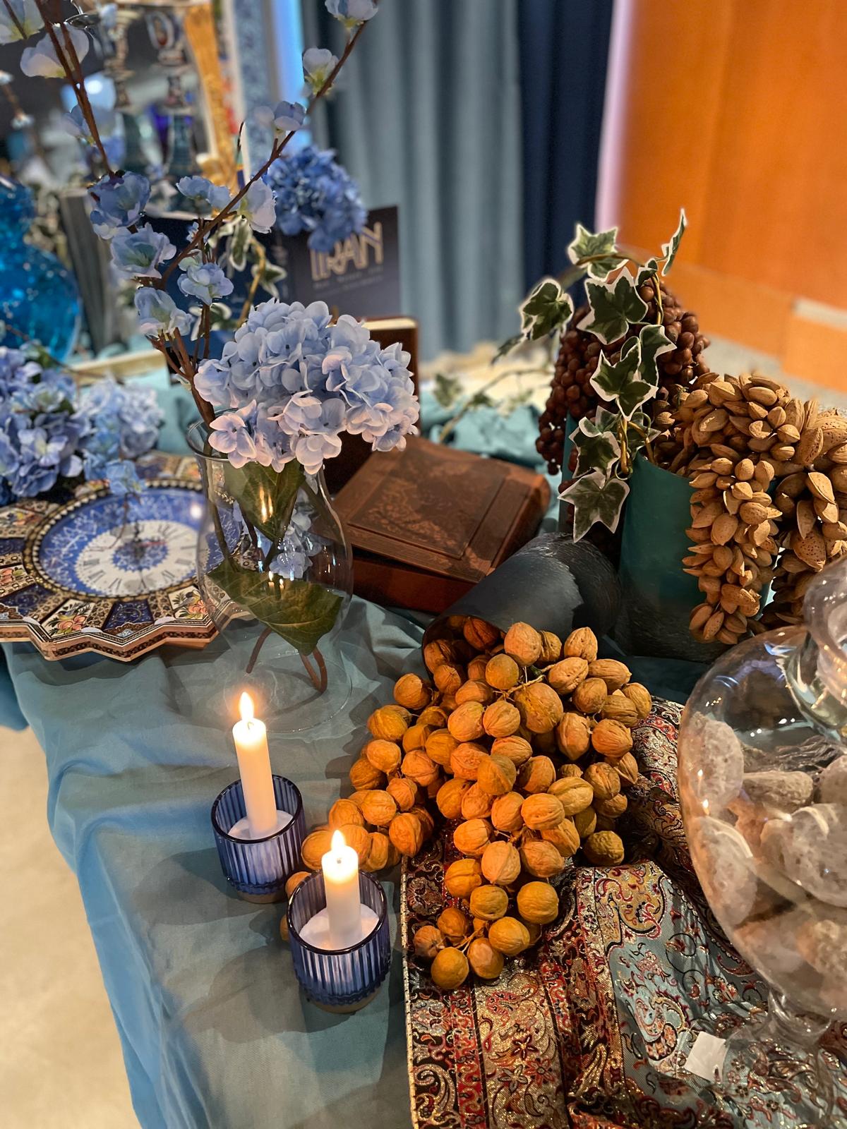 Nowruz — blue hydrangea, walnuts & Persian rug